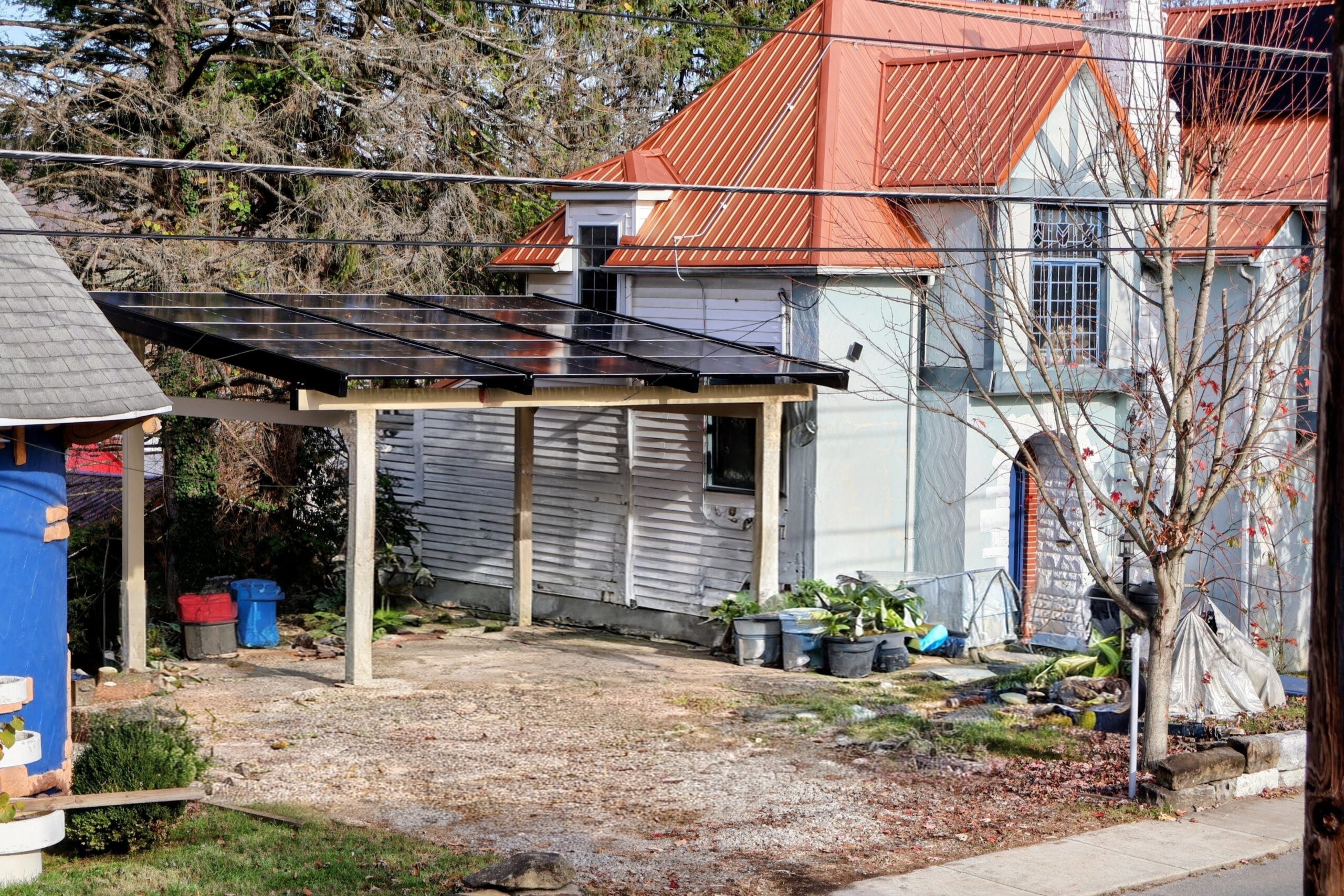 Residential solar carport beside a home