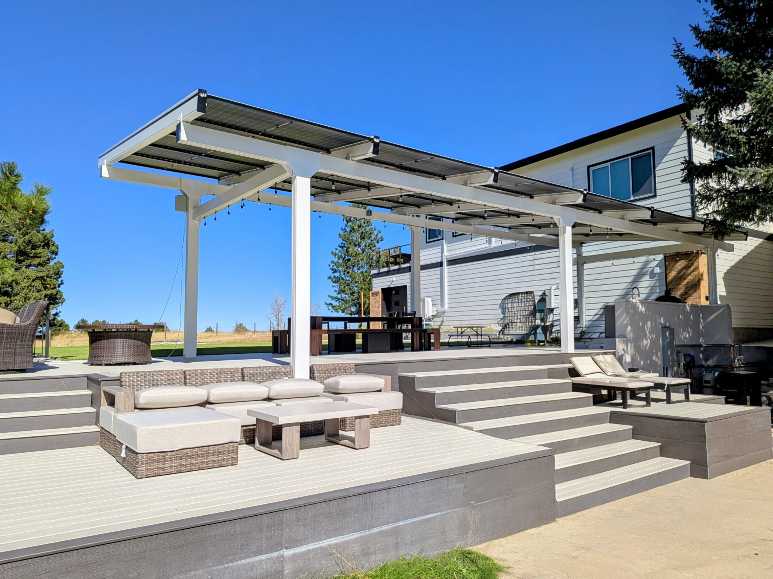Infinity Rack residential solar pavilion over a backyard patio